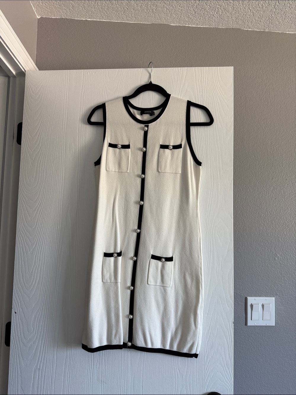 Sleeveless White Knit Dress with Black Trim